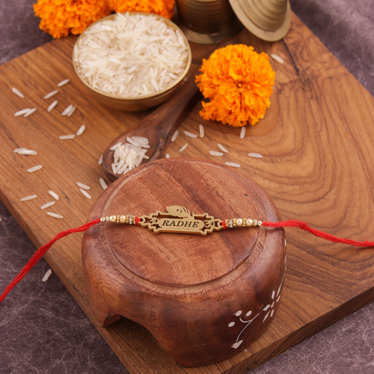 Customized Metal Rakhi With Red Thread